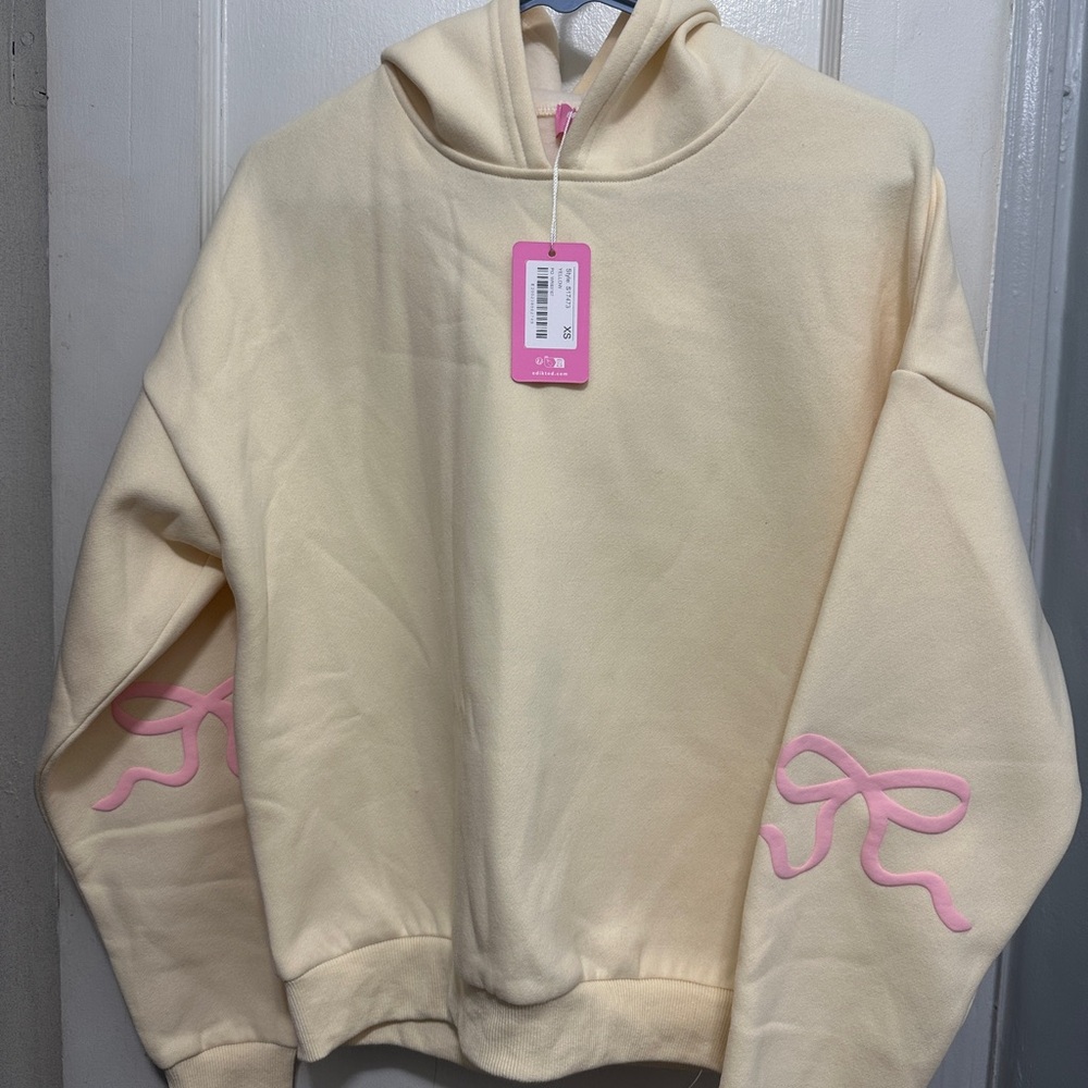 Edikted Cream Hoodie with Pink Bow Accents